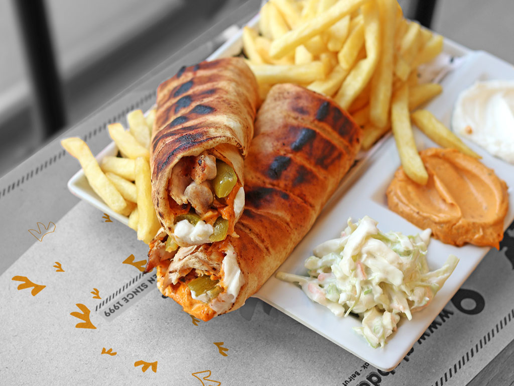 two shawerma sandwich served with frinsh fries